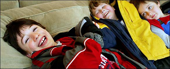 Jake Exkorn, 8, who had early social skills training, has frequent play dates. He recently horsed around with Sergei Bluman and Will Youmans.