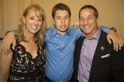 Lisa Ackerman, founder of Talk About Curing Autism, and Jeff and Glen Ackerman pause for a photo at TACA's Ante Up for Autism event Saturday at the St. Regis Monarch Beach Resort in Dana Point.