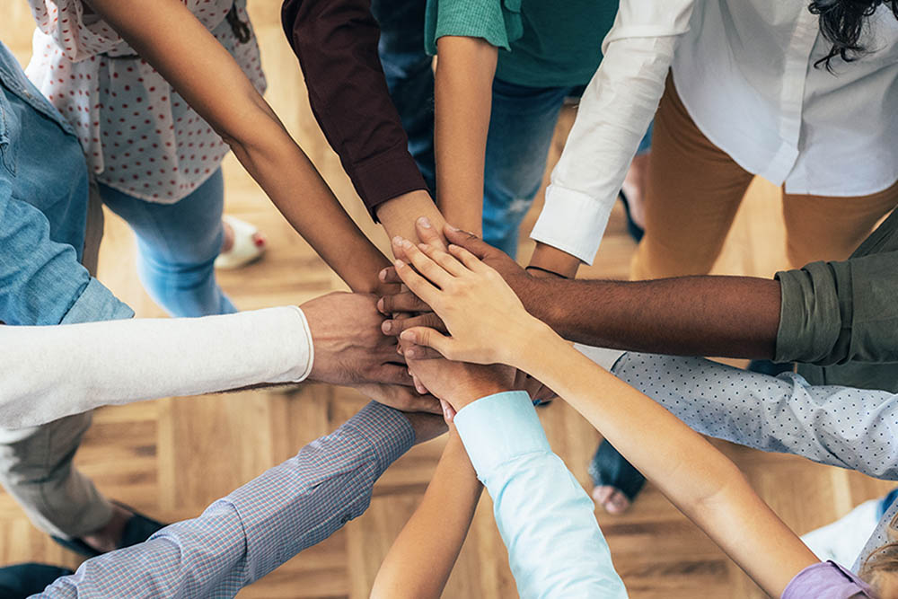 Shot of business people stacking their hands on top of each other, in circle